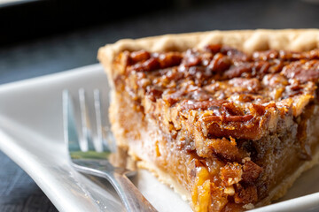 Close-up of piece of pecan pie on plate