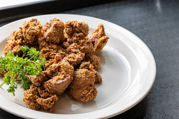 Close-up of fried chicken livers on plate