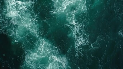 Obraz premium Turbulent teal ocean waves from a high angle.