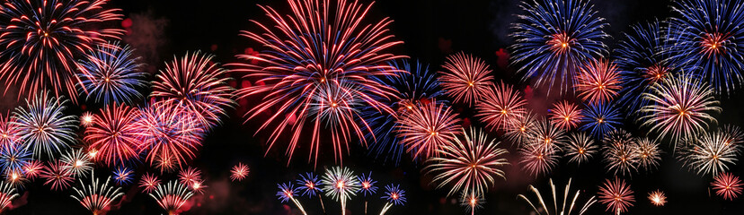 Obraz premium wide background with colorful fireworks in the night sky