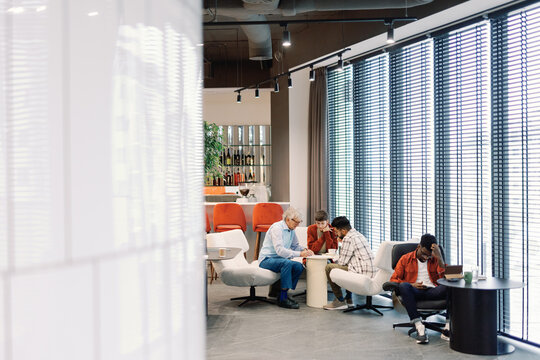 IT company leader andemployees working and brainstorming on project - Powered by Adobe