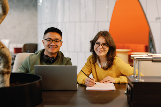 Young smiling multiracial IT company colleagues looking at camera