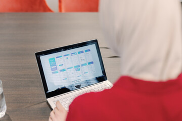 Female IT company designer or developer working on new interface