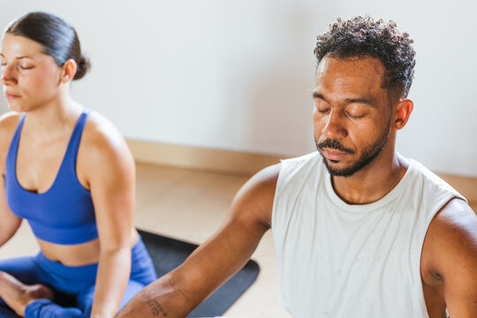 couple doing yoga at home