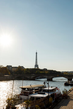 Eiffel Tower standing tall over the Seine River 