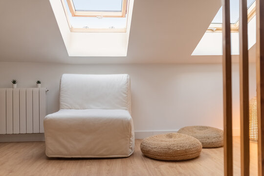 Armchair and poufs at home