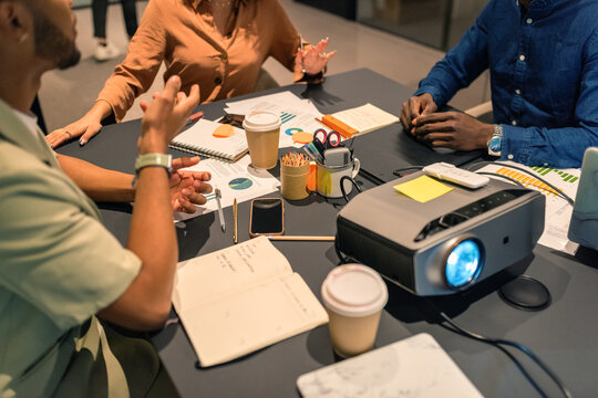 Businesspeople gesticulating at meeting