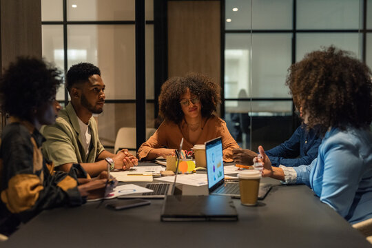 Businesspeople discussing project at meeting room