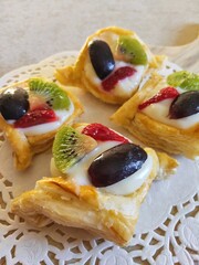 Fruit Puff Pastry, Delicious fruit pastries served on a wooden chopping board
