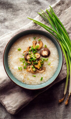 Savory breakfast bowl featuring creamy congee elegantly arranged with mushrooms and fresh green onions