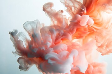 Salmon and grey paint intermingles smoothly, creating a beautiful abstract cloud formation within water