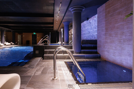 Elegant interior of luxury modern spa club with swimming pools