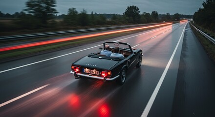 Openair driving on rainslicked highway at dusk