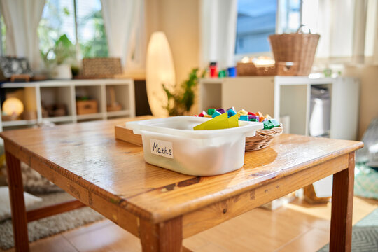 Various study material on wooden table in daycare
