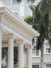 Classical White Column Architecture with Palm Trees © Maria Ponomaryova