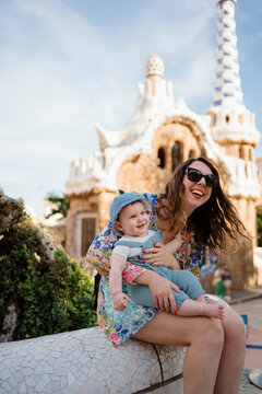 A woman with her son visiting Park Guell in Barcelona, Spain