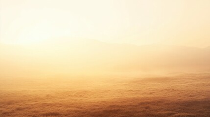 Obraz premium A serene landscape bathed in soft golden light, showcasing a vast expanse of mist-covered grasslands fading into distant hills. The atmosphere conveys a sense of tranquility and an ethereal quality, c