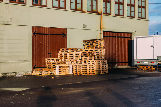 Stacked Wooden Pallets Outside the Warehouse
