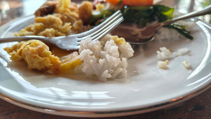 Close-Up Photo of Partially Eaten Food on White Plate