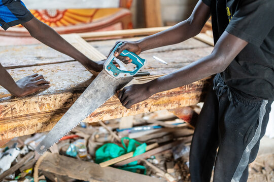 Carpenters sawing wood in Senegal, Africa