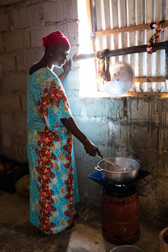 Senegalese woman cooking traditional food in Senegal, Africa