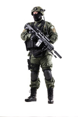 SWAT officer prepared in full tactical gear with a rifle
