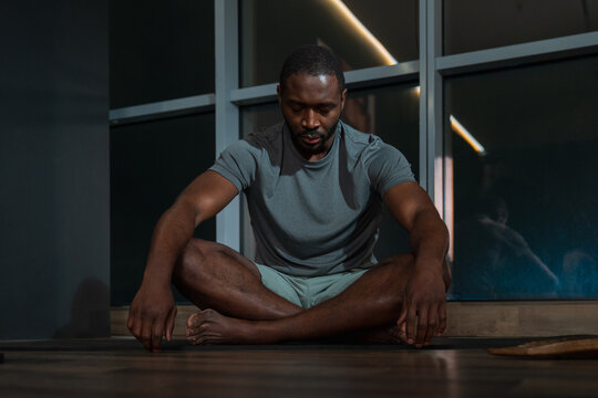 Man Practicing Meditation at Night