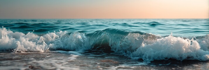 Foamy ocean waves crashing on a sandy shore at sunset. Possible use Nature photography, travel brochures, digital wallpaper