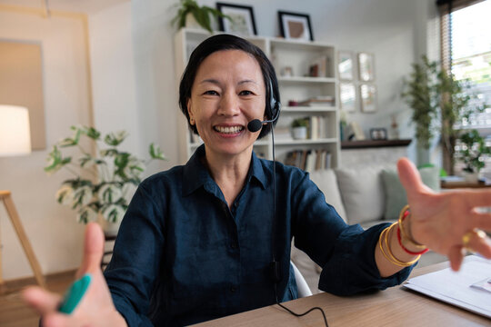 Woman on a video call explaining using her hands