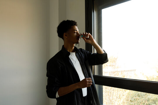 man using Nasal spray