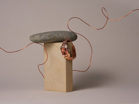 Elegant Rose Gold Watch Balancing on Stylish Display