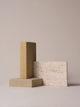 A minimalist composition featuring neutral-toned rectangular stone