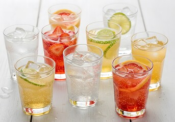 Refreshing Summer Drinks Sparkling Water with Fruit, Lime, Strawberry, Grapefruit, Healthy Beverage Assortment.