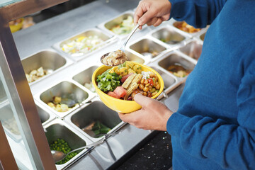 Enjoying a fresh salad bowl at a vibrant food station
