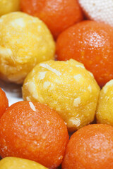Colorful indian sweets displayed during a festive celebration