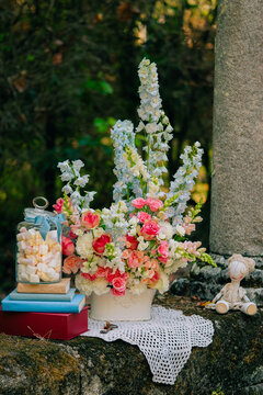Floral arrangement with books and vintage decor