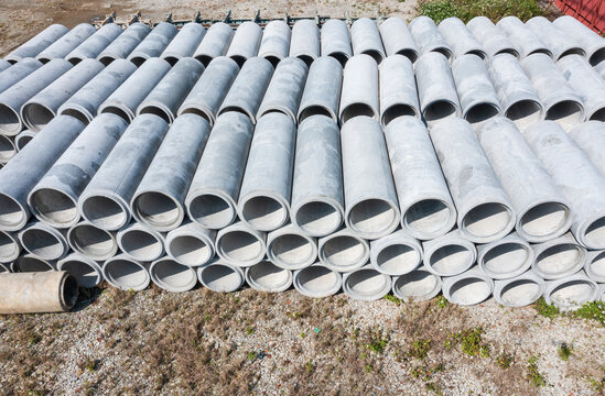 Stacked Concrete Drainage Pipes at Construction Site
