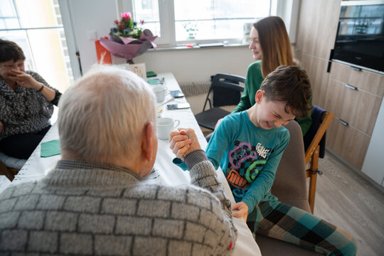 Family Fun: A Friendly Arm Wrestling Match at Home