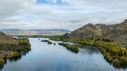 Autmnal foliage on the trees around the Waitaki river Lake Benmore