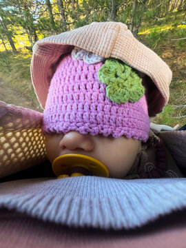 Baby sleeping during forest hike