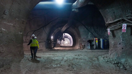 Engineers Observing Progress in an Underground Tunnel Construction