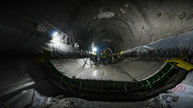 Construction Workers Operating Inside a Tunnel Under Development