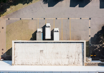 Aerial View of Trucks Parked at Small Factory Entrance