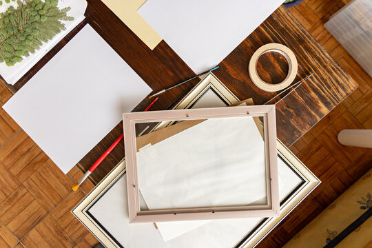 An overhead close-up of a creative person's workspace