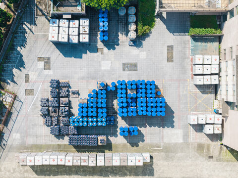 Aerial View of Industrial Chemistry Storage with Blue Barrels