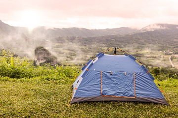 Blue tent, mountain camping, morning fog, nature tourism, adventure