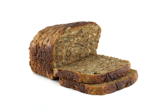 Rustic loaf of sliced multigrain bread with seeds on a clean white background for a healthy choice