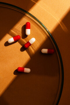 Daliy nutrition intake of capsule pills in glass plate