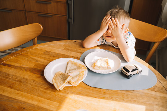 Child reacts to unexpected food choices at home meal time