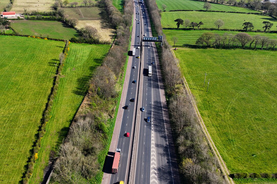 Aerial drone video of traffic on the M2 Motorway at Templepatrick Town County Antrim Northern Ireland
